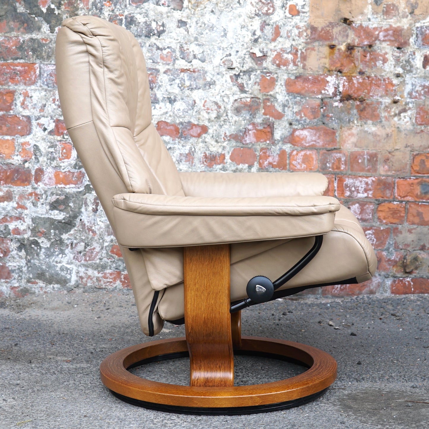 Beige Ekorness Stressless ‘Mayfair’ chair and footstool