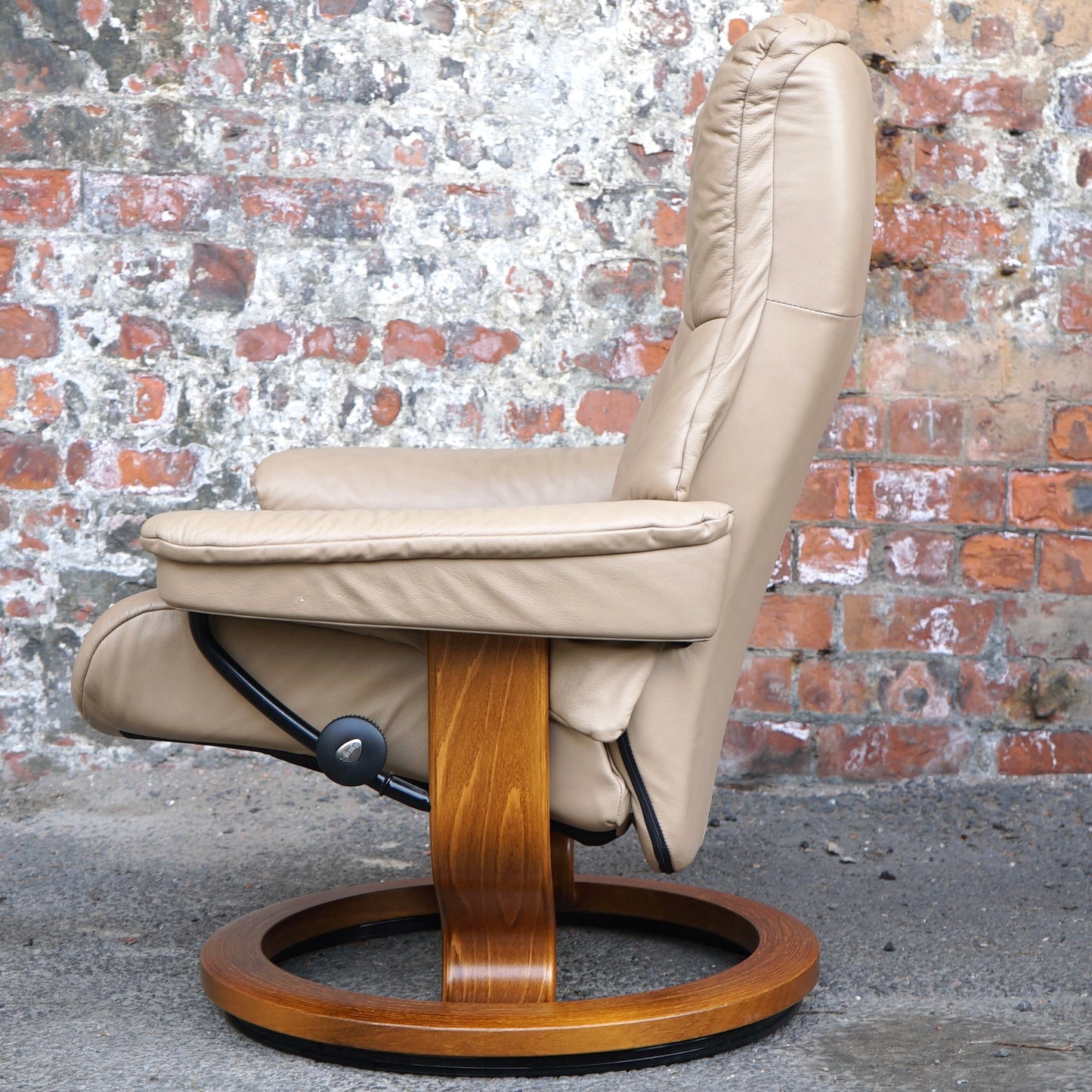 Beige Ekorness Stressless ‘Mayfair’ chair and footstool