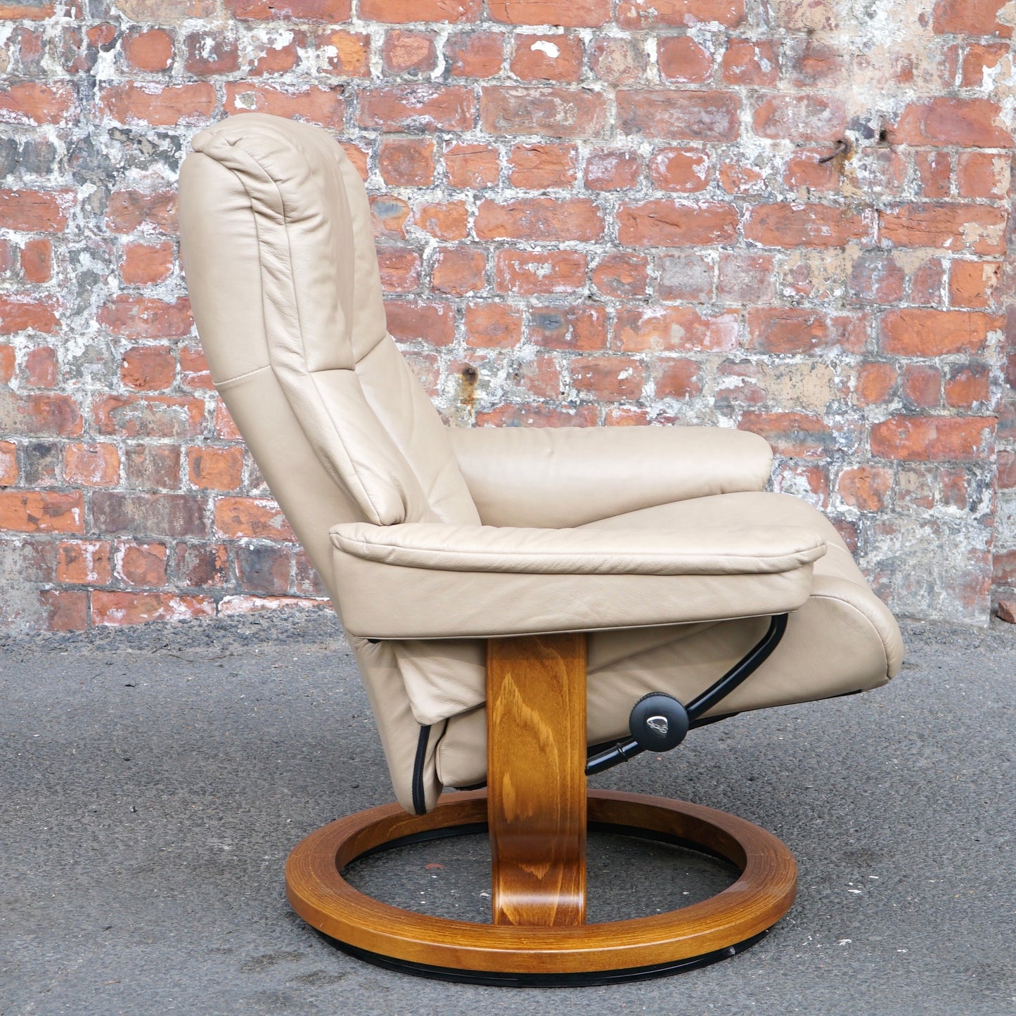 Beige Ekorness Stressless ‘Mayfair’ chair and footstool